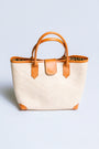 The Winding Road Rolled Leather Handle Rattan Tote