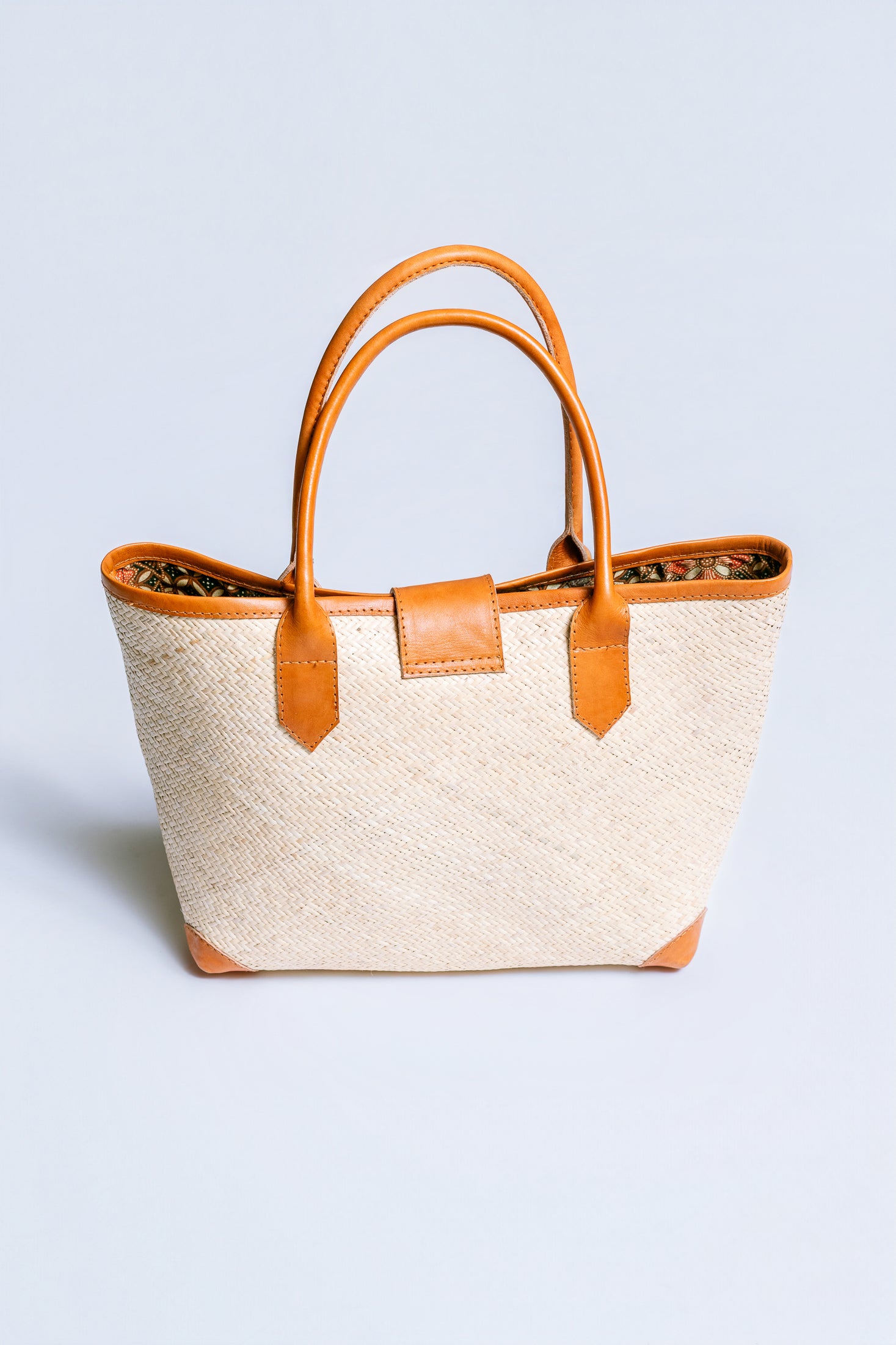 The Winding Road Rolled Leather Handle Rattan Tote